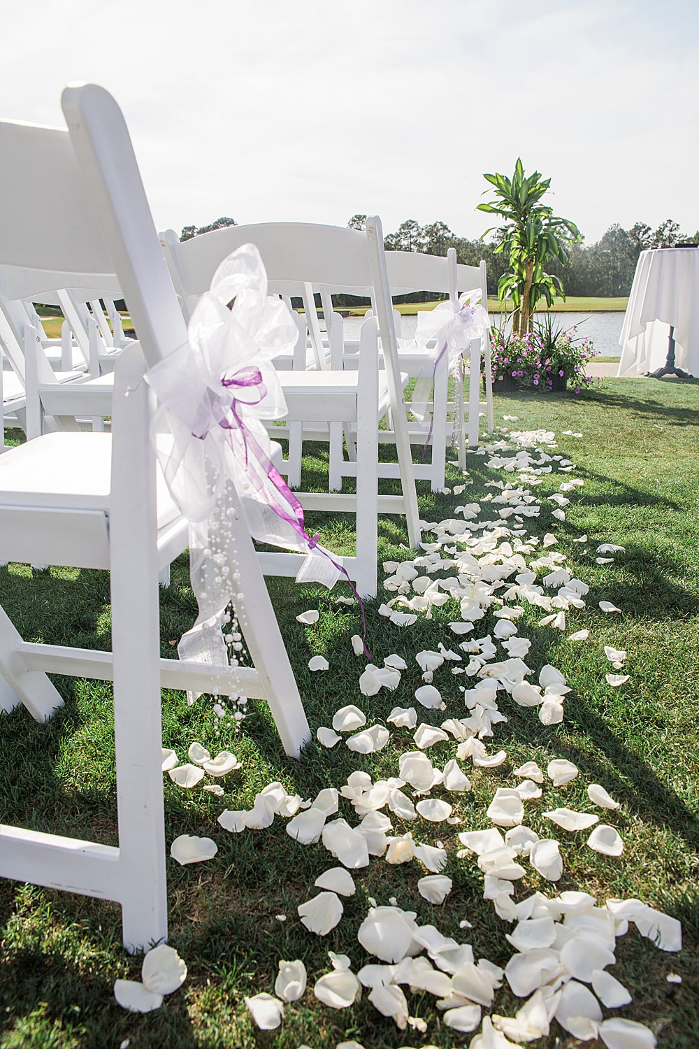 Flower petals line the aisle of the st johns golf and country club wedding area